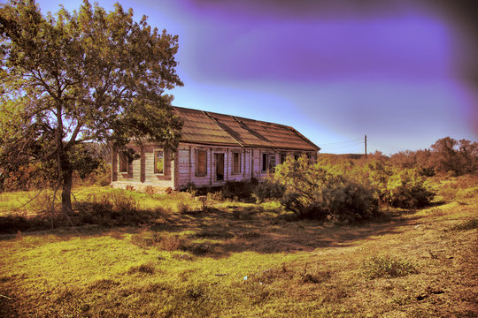An old abandoned wooden house with walls made of straw. Astrakhan region. Russia.
HDR Photo with post processing effects.
