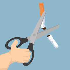 Scissors cutting a cigarrette