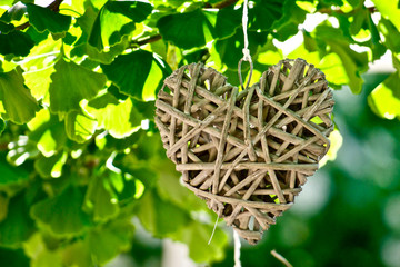 Rattan heart ornament / Bast heart-shaped decoration hanging on a tree