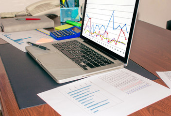 Business finance paper chart on desk.