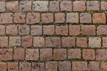 Overhead view of cobblestone street texture. Stone pavement texture.