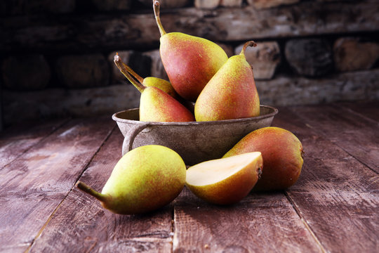 Fresh ripe organic pears on rustic wooden table, natural background, vega, diet food.