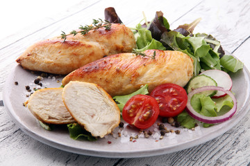 Grilled Chicken Breast with Salad and cherry tomatoes.