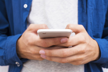 close-up of hands with mobile phone