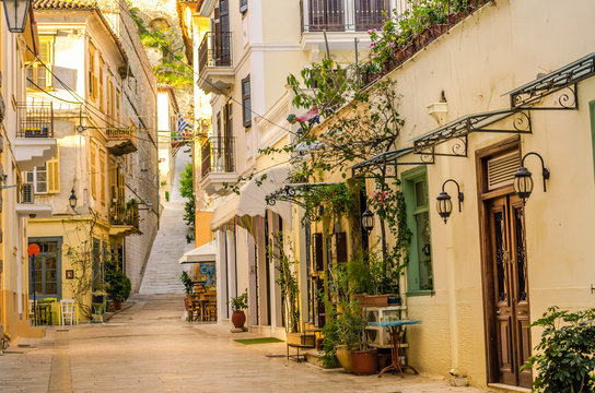 Fototapeta Nafplio-one of the narrow cobblestone alleys with the neoclassical well preserved buildings of the old town.