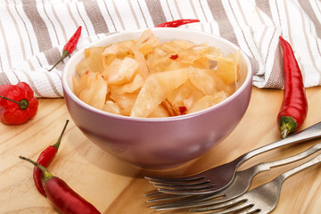 traditional korean food kim chi in a bowl on wooden plate