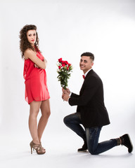 elegant couple problem solving with red roses