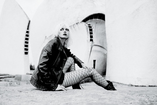 monochrome portrait of stylish blonde grunge young woman 