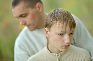 Father and son in autumn