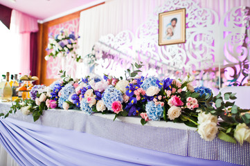 Floral compositions made of different flowers, decorated for the wedding celebration in the restaurant exclusively.