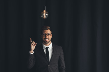 handsome businessman with lightbulb