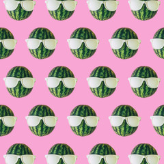 watermelon heads with sunglasses on pink background. Minimal concept of food.