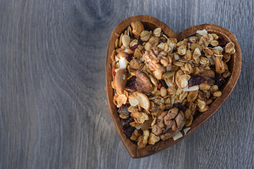 homemade granola in wooden bowl