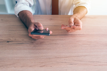 Mobile banking smartphone app used by businessman