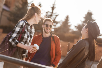 smiling friends on street