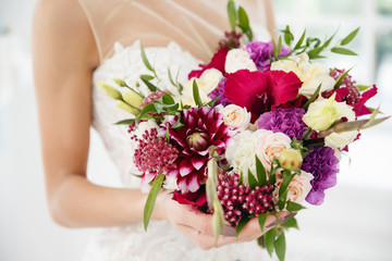 wedding bouquet. The bride is holding flowers for the engagement.