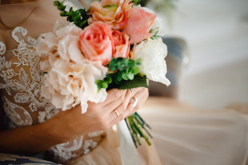 wedding bouquet. The bride is holding flowers for the engagement.