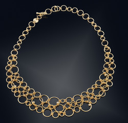 Golden necklace with isolated on black