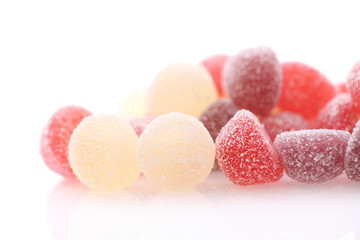 Colorful jelly sugar candies close up isolated in white background