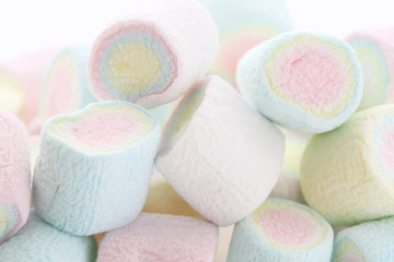 Fototapeta na wymiar Pastel colourful marshmallows isolated in white background