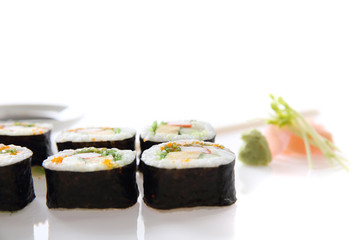 Futomaki sushi , Japanese roll rice egg avocado cucumber and caviar isolated in white background