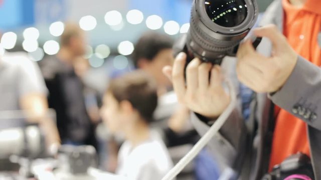 A man in a store buys a photo camera
