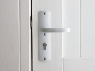 White door with chrome doorhandle
