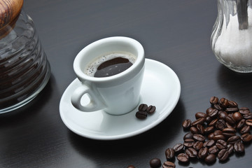 pile of coffee beans and a cup