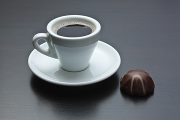 cup of coffee and chocolate candy