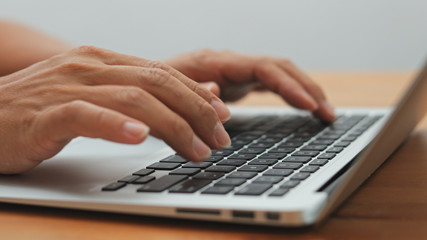 Woman working on laptop computer at home