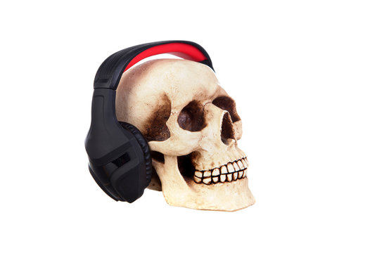 Human skull in headphones