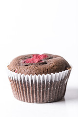 Chocolate cup cake muffin with fresh raspberry isolated on the white background with copy space