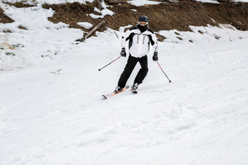 skier is skiing down the slope in the woods