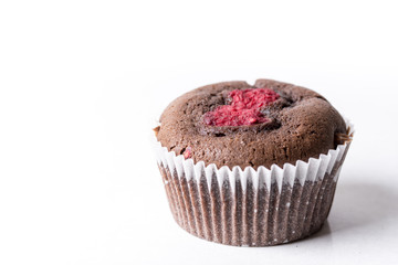 Chocolate cup cake muffin with fresh raspberry isolated on the white background with copy space