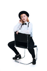 Modern girl in black hat on isolated background in a studio
