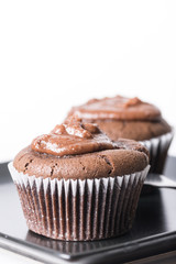 Selective focus on chocolate cup cake muffin on the black square plate