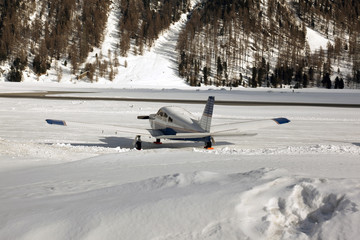 An airplane in the snow covered landscape