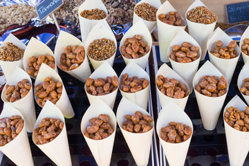 cones with delicious sugared peanuts on market