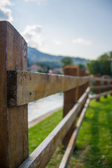 wooden fence on the edge of the lake