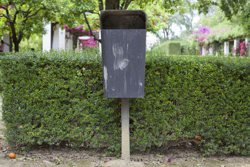 Trash can in the park in the city