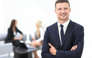 successful businessman on blurred background office