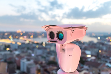 Security CCTV camera, surveillance system at blurred city background. Concept of city security and protection from terrorism and terrorist attacks