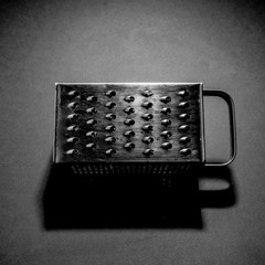 B&W picture of a kitchen rasp, with high contrast, 