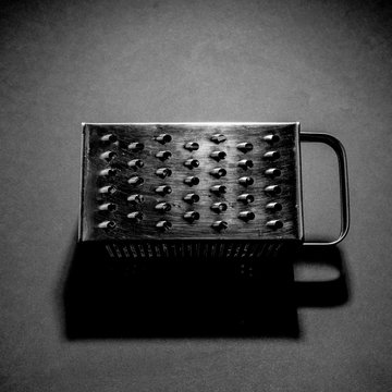 B&W picture of a kitchen rasp, with high contrast, 