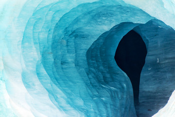 Abstract view of the entrance of an ice cave in the glacier Mer de Glace, in Chamonix Mont Blanc Massif, The Alps, France