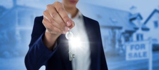 Composite image of mid section of businesswoman showing house