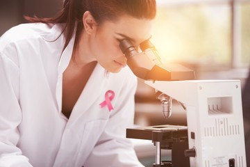 Composite image of breast cancer awareness ribbon - Powered by Adobe