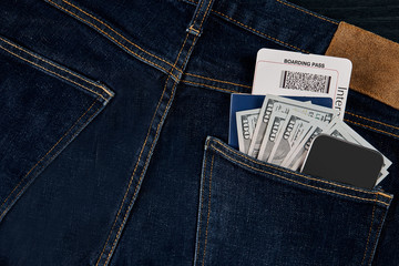 Dollars, smart, passport and plane ticket in your pocket jeans.