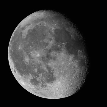 Moon Waning Gibbous 87% phase against black night sky high resolution image