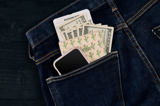 Dollars, smart and plane ticket in your pocket jeans.